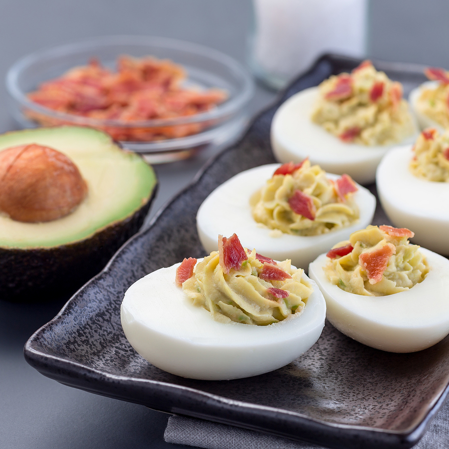 Deviled Eggs Stuffed With Avocado, Egg Yolk And Mayonnaise Filli