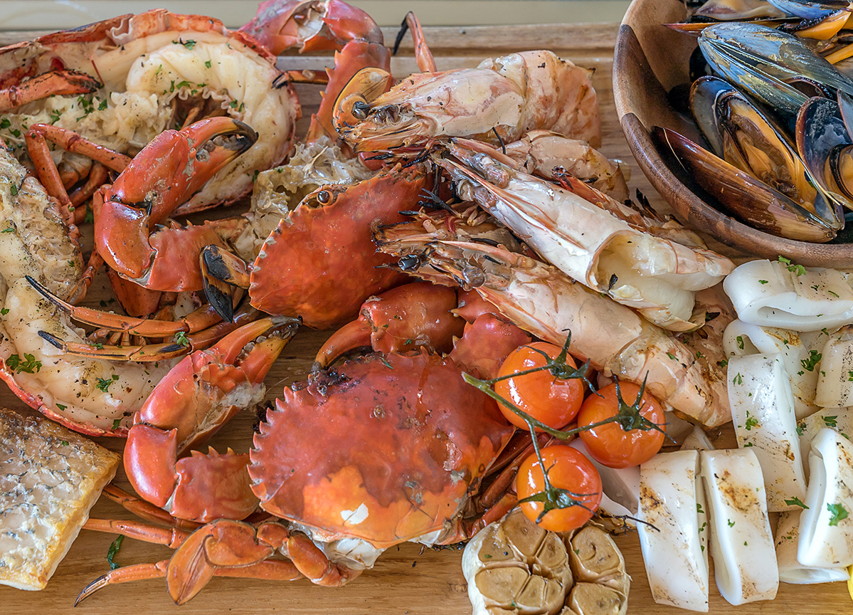 groumet seafood platter on wooden plate