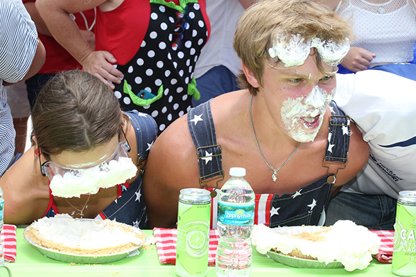 The July 4 World Famous Key Lime Pie Eating Championship welcomes up to 25 contestants to compete in a timed race to consume a 9-inch Key Lime pie, topped with whipped cream, without using their hands. The sensationally sloppy competition is part of Key West’s annual Key Lime Festival, which runs July 1-5 this year. (Photo: Carol Tedesco – Key Lime Festival)