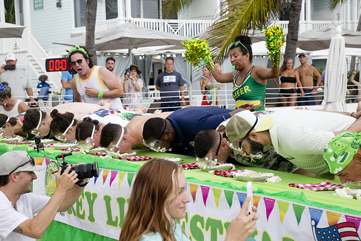 The July 4 World Famous Key Lime Pie Eating Championship welcomes up to 25 contestants to compete in a timed race to consume a 9-inch Key Lime pie, topped with whipped cream, without using their hands. The sensationally sloppy competition is part of Key West’s annual Key Lime Festival, which runs July 1-5 this year. (Photo: Carol Tedesco – Key Lime Festival)